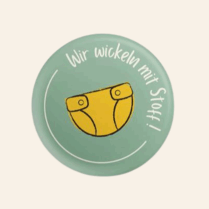 Button „Wir wickeln mit Stoff“ – Gelb (5er Pack)